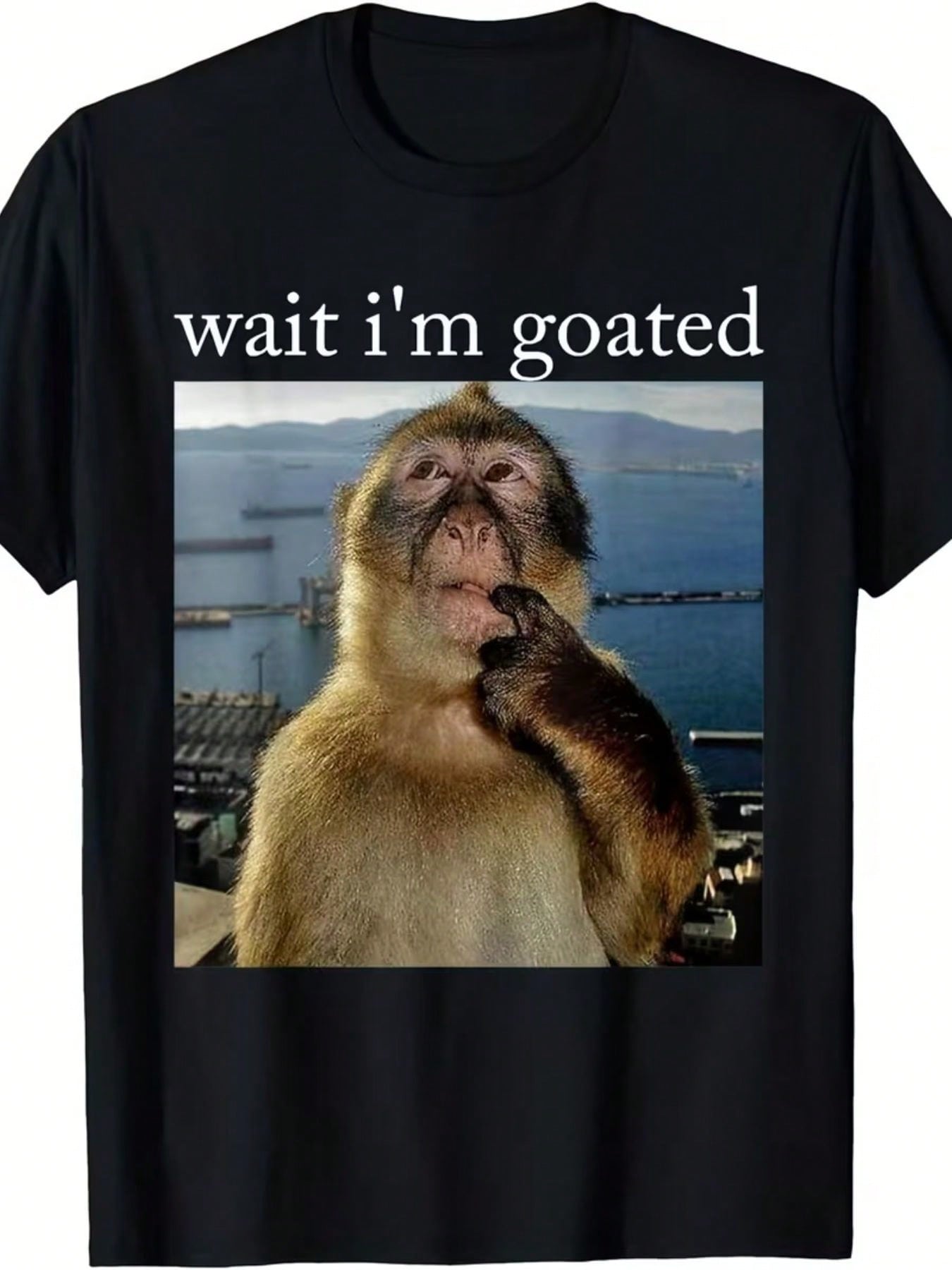 Funny 'Wait I'm Goated' Black T-Shirt With Thoughtful Monkey Design - Stylish Graphic Tee Featuring A Barbary Macaque In A Scenic Coastal Setting - Ideal Gift For Animal Lovers And Humor Enthusiasts