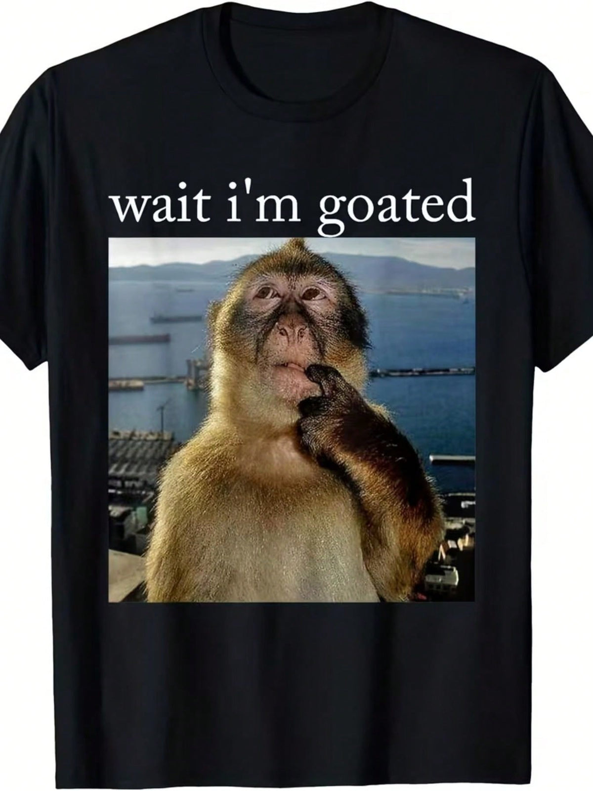 Funny 'Wait I'm Goated' Black T-Shirt With Thoughtful Monkey Design - Stylish Graphic Tee Featuring A Barbary Macaque In A Scenic Coastal Setting - Ideal Gift For Animal Lovers And Humor Enthusiasts