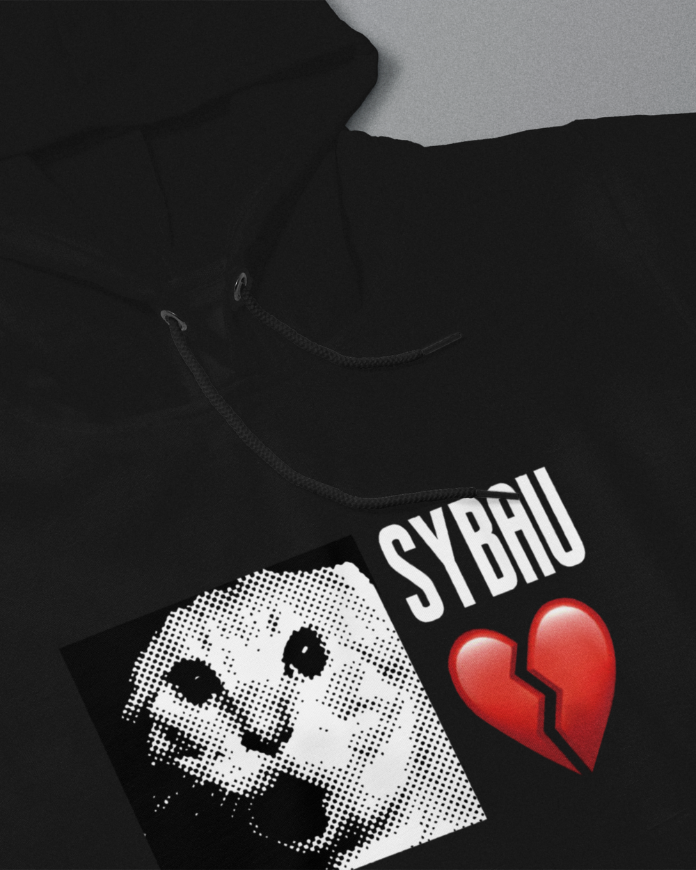 Black hoodie with graphic design and text on a gray background