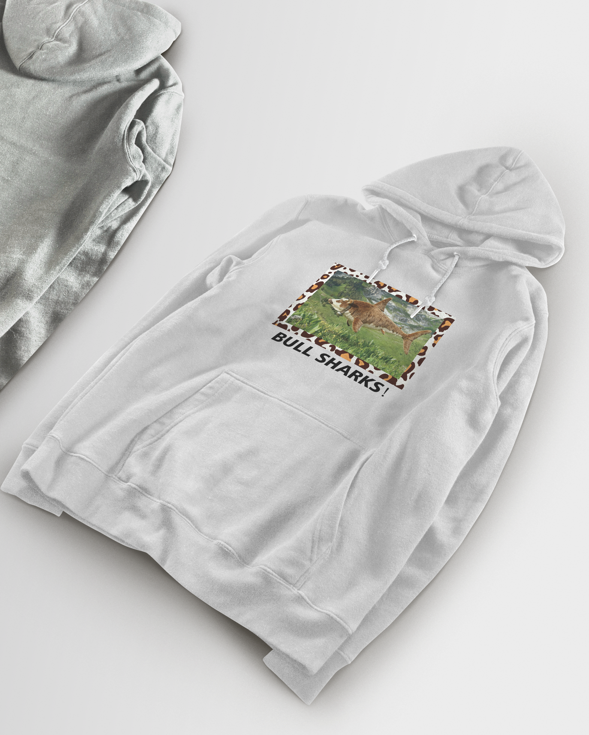 Light gray hoodie with a graphic design on a white background
