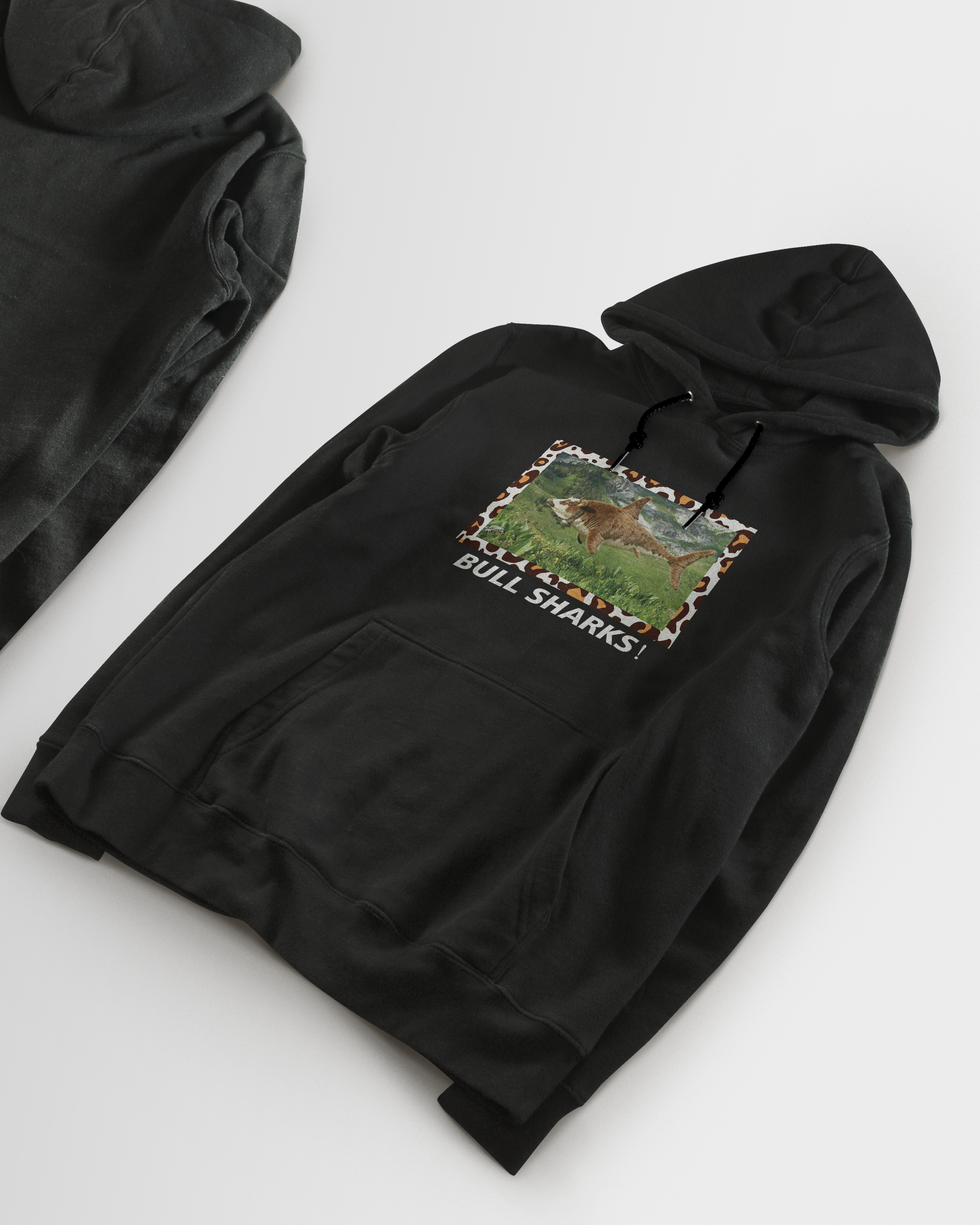 Black hoodie with a graphic design on a white background