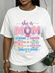 She Is Mom Inspirational Scripture Graphic T‑Shirt, Colorful Floral Faith Crewneck Short Sleeve Tee, Encouraging Gift for Mothers