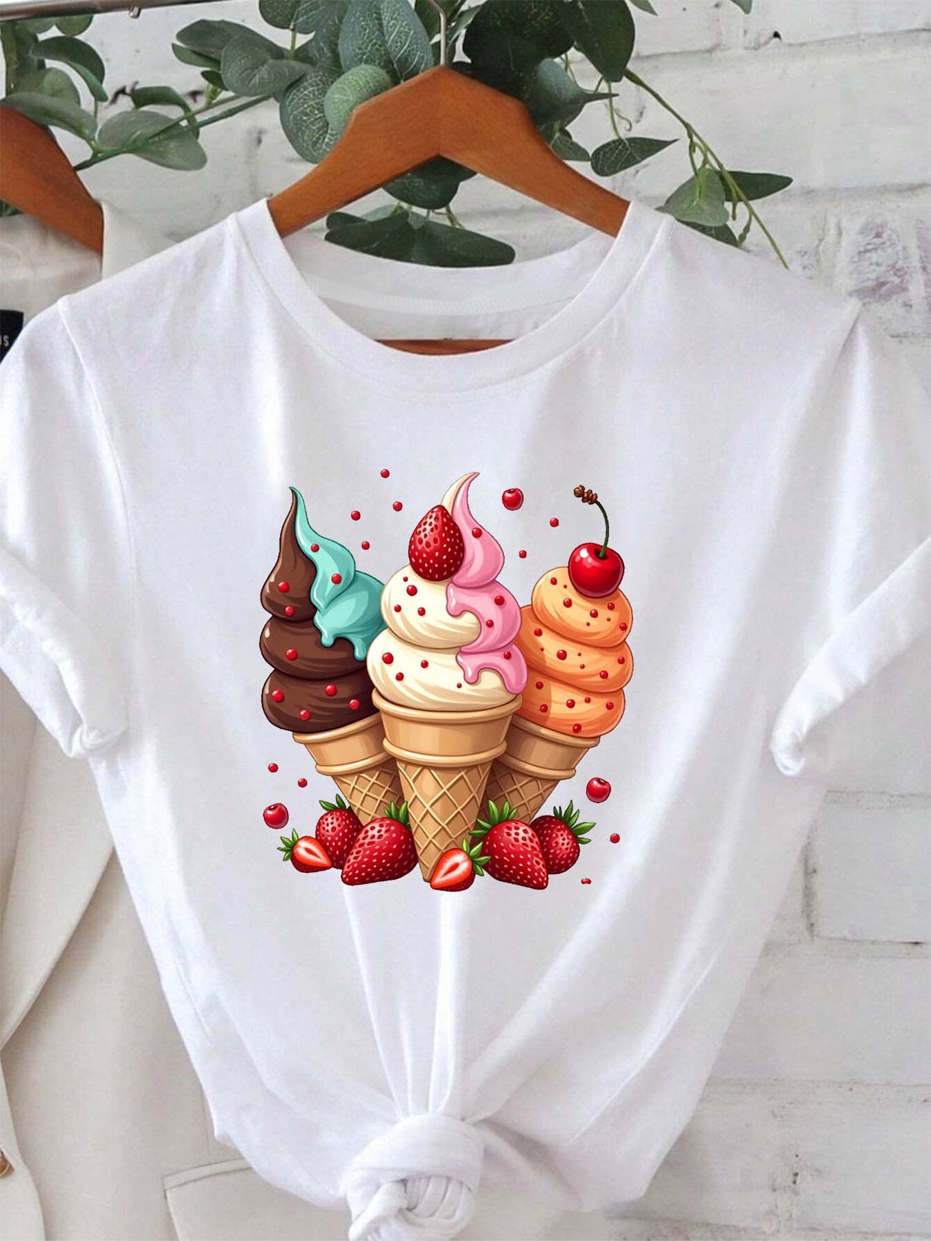 A Sweet And Vibrant Summer Ice Cream Cone, Featuring a Stylish Women'S Casual Round-Neck T-Shirt with Fruit Patterns Like Strawberries And Cherries, Perfect for Outings, Vacations, And Shopping