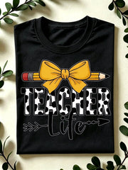 Women's Teacher Life Graphic T-Shirt, 100% Cotton Cow Print Teacher Lettering with Pencil and Yellow Coquette Bow, Crew Neck Short Sleeve Back to School Gift